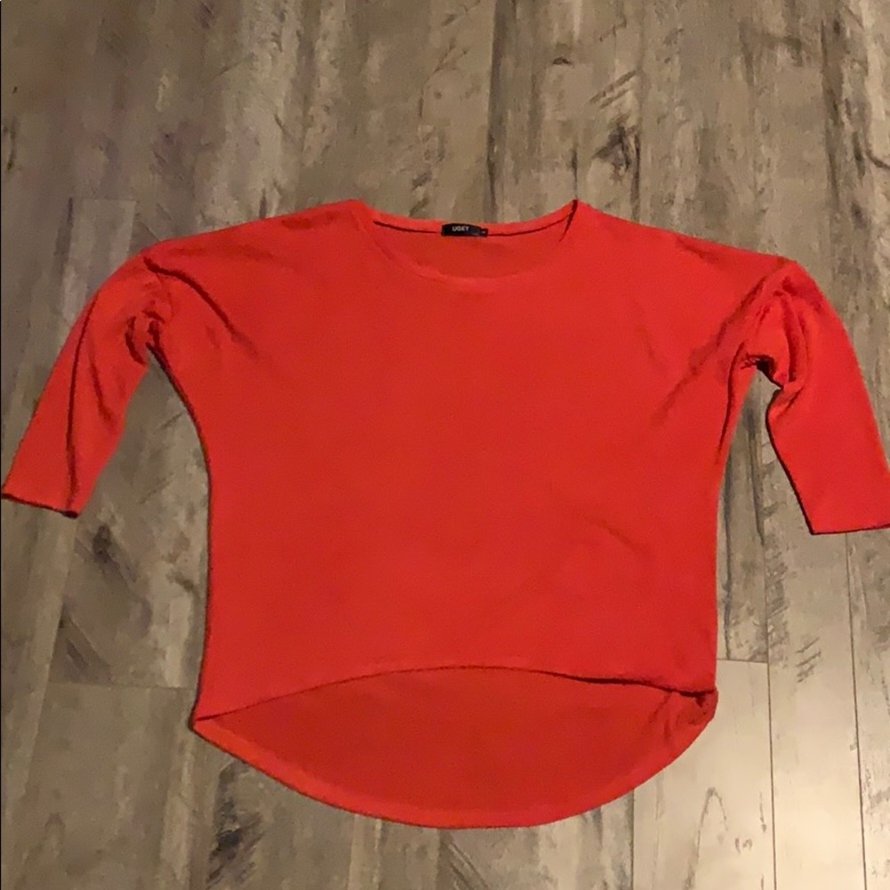 Orange sweater.